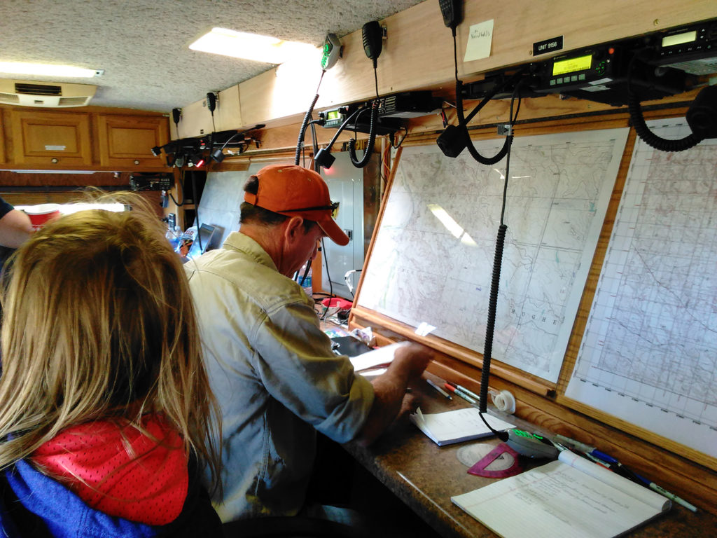Bruce Halleen and Michele Gaylord plotting SAR Unit movements in the emergency operations center trailer.