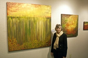 ART ON THE MIND — Marie Snavely of Bowman says her creative impulses come as spirts. She debuted her 21-piece acrylic collection Jan. 3 at Dickinson State University. PHOTO BY BRYCE MARTIN/PIONEER