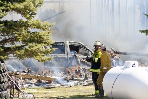 A truck was parked in the home's garage and ultimately destroyed by the fire. (Photo by Bryce Martin | Pioneer)