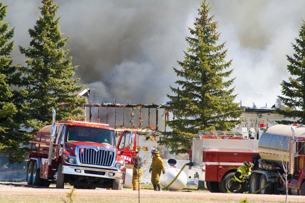 A massive fire broke out around noon April 13 at a residence on 6th Ave NE in Bowman. Flames destroyed most of the home. (Photo by Bryce Martin | Pioneer)
