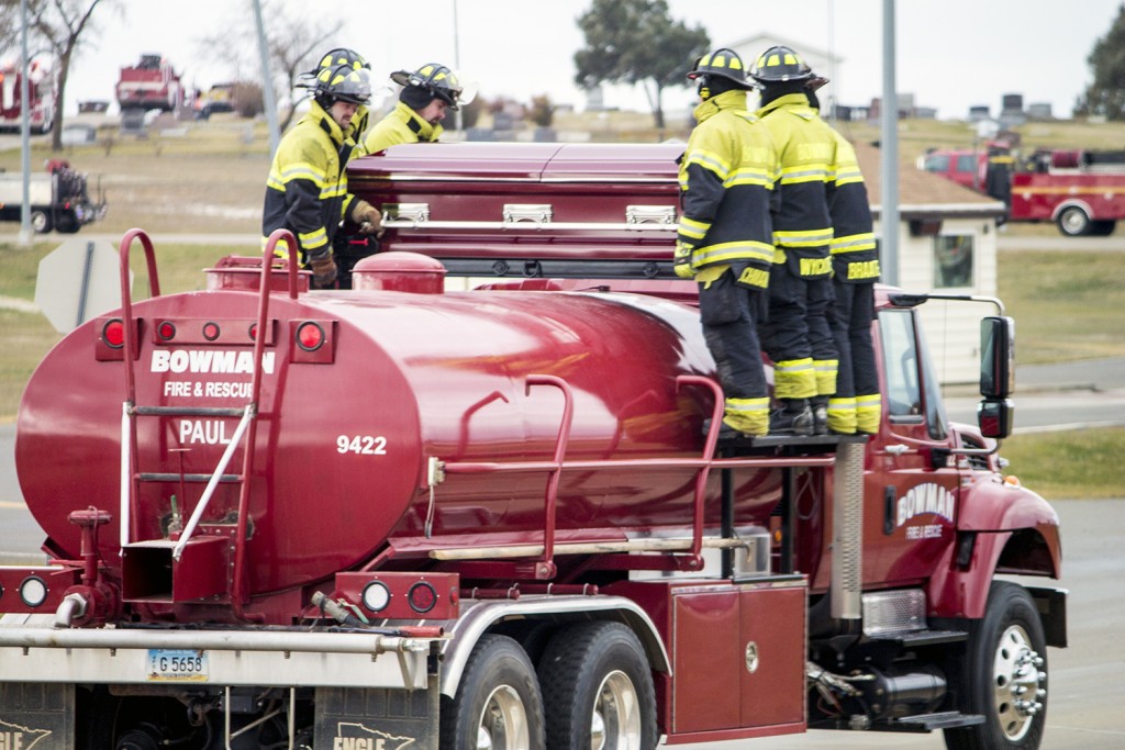 Paul Mosbrucker’s casket precedes a long line of fire engines, which turned out to support their fallen “brother.” (Photo by Bryce Martin/Pioneer)