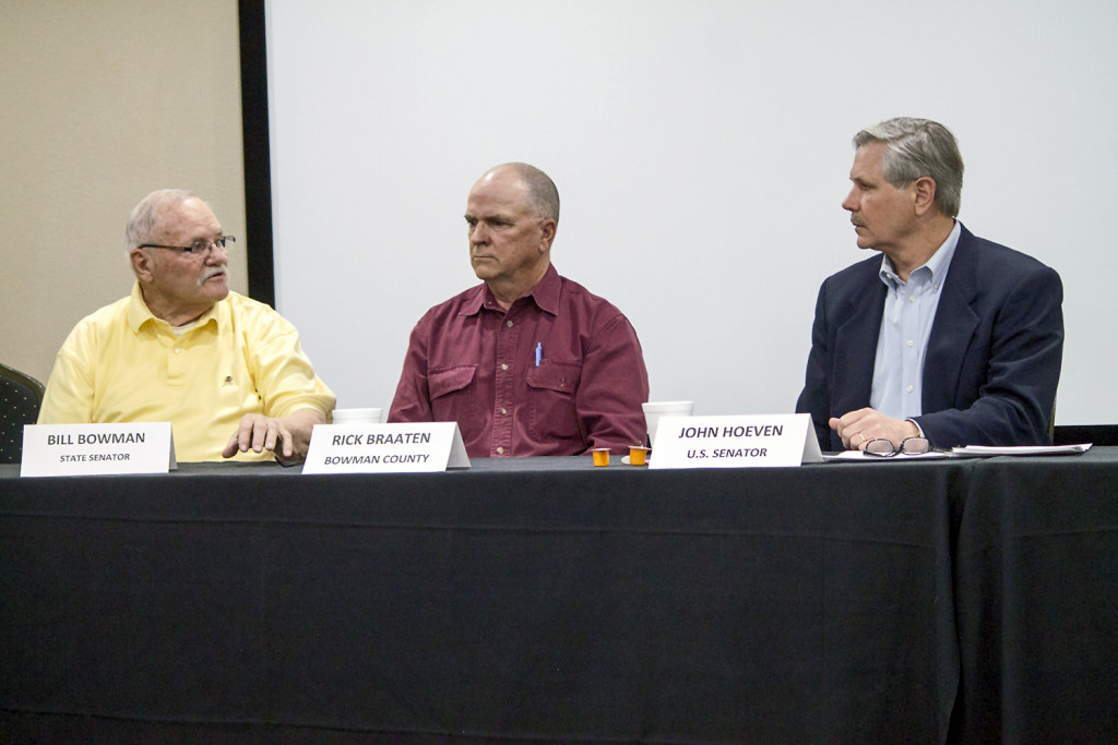 State Sen. Bill Bowman, left, voices his concern with federal appropriations as County Commission Rick Braaten, center, and Sen. John Hoeven, right, listen during a roundtable discussion on Monday in Bowman. (Pioneer Photo by Bryce Martin)
