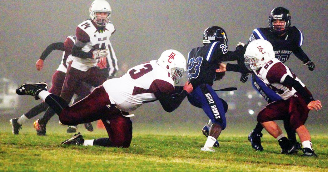 Bowman County’s defense goes in for a tackle with the Night Hawks holding the ball. The Bulldogs suffered a tough 24-0 loss Sept. 23 against Hettinger-Scranton. (Pioneer Photo by Jason Waskiewicz)