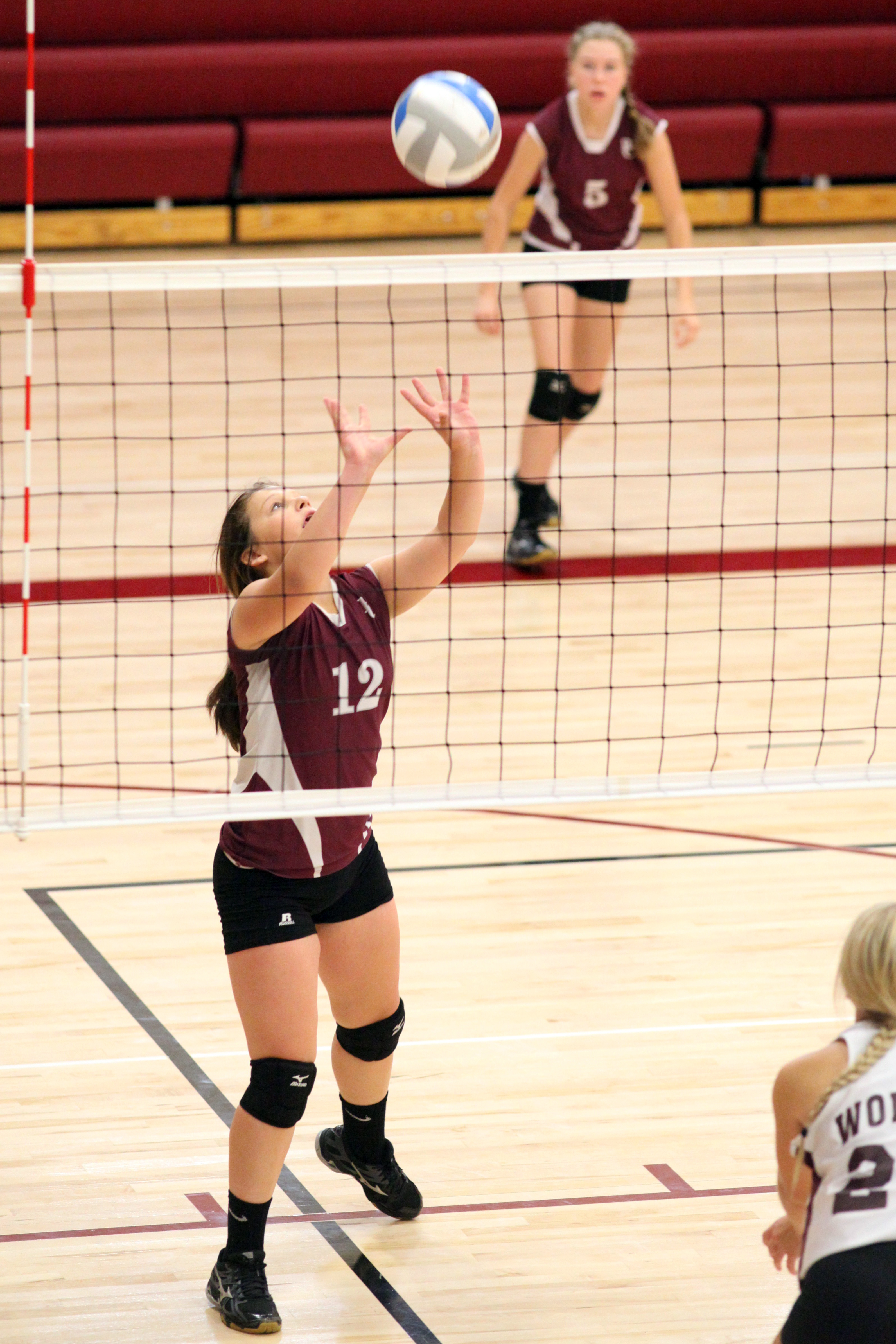 Shelby Schmalz going for a set during the C-Squad tournament. (Photo by Jason Waskiewicz)