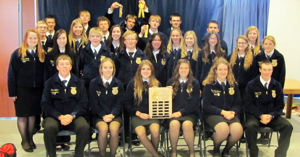 The group of Bowman County FFA members smile proudly with their award for District 8’s FFA Chapter of the Day, awarded Sept. 28 in Dickinson. (Courtesy photo)