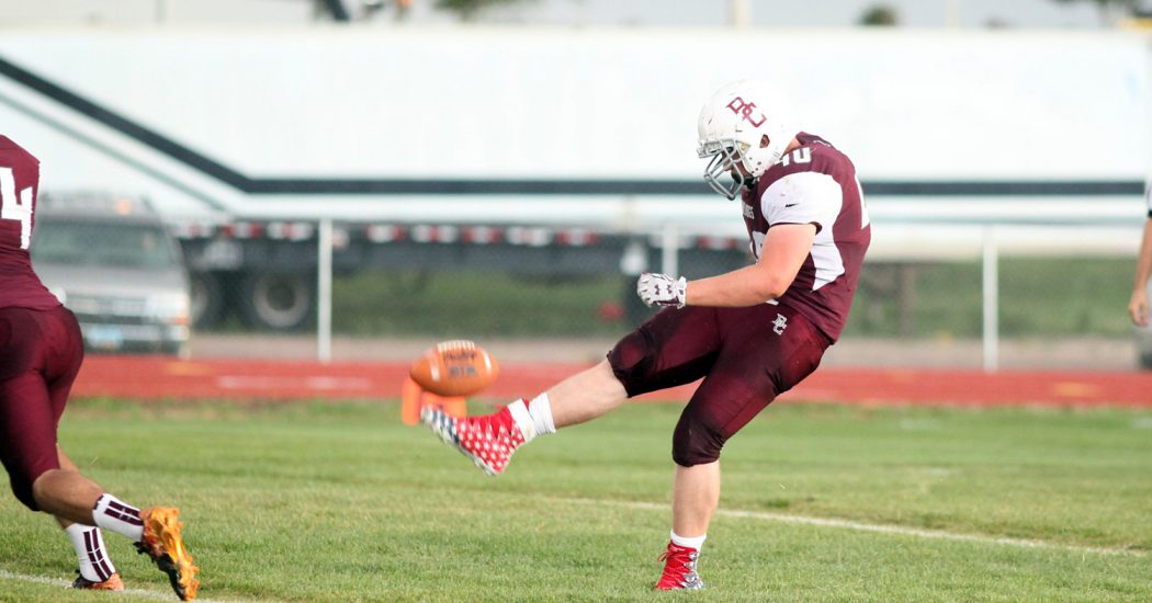 Tristen Peterson, a junior at Bowman County High School, makes a kickoff during a Bulldogs varsity football game against Lemmon. (Pioneer Photo by Jason Waskiewicz)